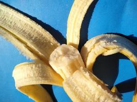 bananas on a blue background.cold tone photo