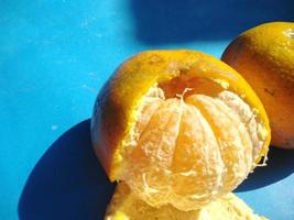 orange on a blue background.high angle view.cold tone photo