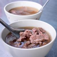 Beef soup - famous food in Taiwan, Asia, Asian Taiwanese street delicacy cuisine, close up, lifestyles, traditional breakfast in Tainan. photo