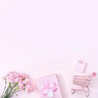 Mother's Day, Valentine's Day background design concept, beautiful pink carnation flower bouquet on pastel pink table, top view, flat lay, copy space. photo