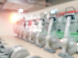 Abstract blur fitness gym equipment background photo