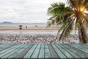 Wooden table with beach landscape Blur Background photo