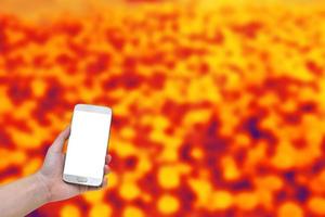 person using mobile smart phone with abstract background photo