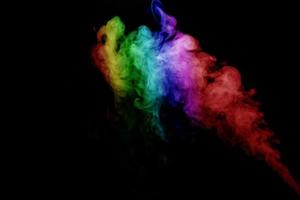 Abstract smoke isolated on black background,Rainbow powder photo