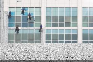 Marble table with workers cleaning building blur background photo