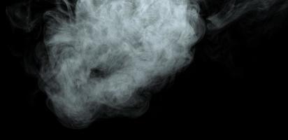 Abstract powder or smoke isolated on black background photo