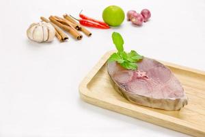 Fillet of Spanish Mackerel Slide on chopping block,Scomberomorus photo