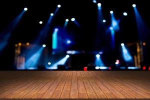 top desk with light bokeh in concert blur background,wooden table photo