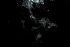 Abstract powder or smoke isolated on black background photo