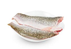barramundi or seabass fish sliced with dish isolated on white background ,include clipping path photo