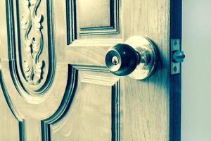 knob on old wooden door,vintage effect filter photo