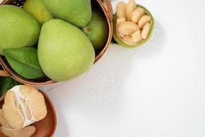 Fresh pomelo, pummelo, grapefruit, shaddock on white background, fruit for Mid-autumn festival, top view, flat lay. photo