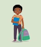 Happy little African boy student with backpack holding book and pen feeling excited to be back to school vector