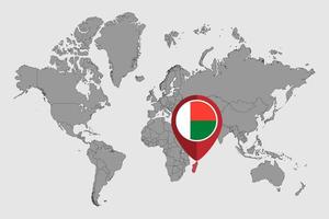 pin mapa con la bandera de madagascar en el mapa mundial. ilustración vectorial vector