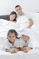 happy young Family in their bedroom photo