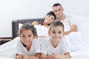 happy young Family in their bedroom photo