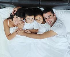 happy young Family in their bedroom photo