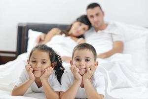 happy young Family in their bedroom photo