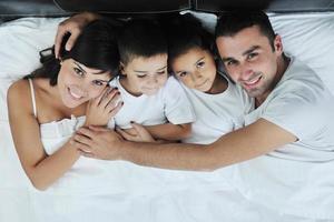 happy young Family in their bedroom photo