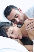 young couple have good time in their bedroom photo