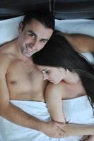 young couple have good time in their bedroom photo