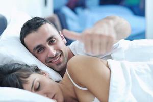 young couple have good time in their bedroom photo