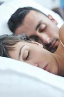 young couple have good time in their bedroom photo