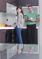 young couple have fun in modern kitchen photo