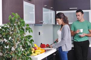 young couple have fun in modern kitchen photo