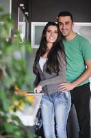 young couple have fun in modern kitchen photo