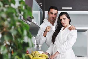 Young love couple taking fresh morning cup of coffee photo