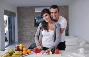 young couple have fun in modern kitchen photo