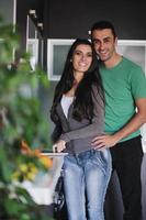 young couple have fun in modern kitchen photo