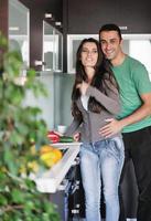 young couple have fun in modern kitchen photo