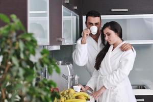 Young love couple taking fresh morning cup of coffee photo