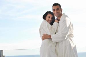 couple relaxing on balcony photo