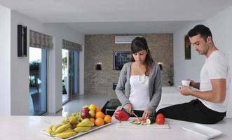 young couple have fun in modern kitchen photo