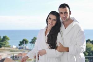 couple relaxing on balcony photo