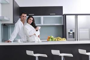 young couple have fun in modern kitchen photo