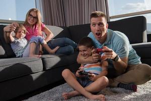 Happy family playing a video game photo