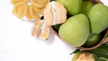 Fresh pomelo, pummelo, grapefruit, shaddock on white background, fruit for Mid-autumn festival, top view, flat lay. photo