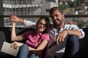 Young couple watching television photo