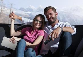 Young couple watching television photo