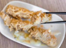 Fried shrimp roll - Taiwanese food cuisine in Tainan, Taiwan restaurant, close up, lifestyle. photo