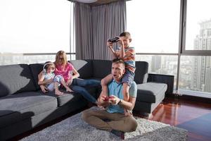 Happy family playing a video game photo