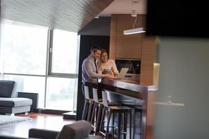 A young couple is preparing for a job and using a laptop photo