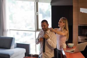 A young couple is preparing for a job and using a laptop photo