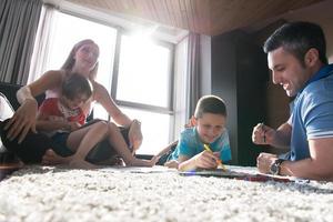 young couple spending time with kids photo