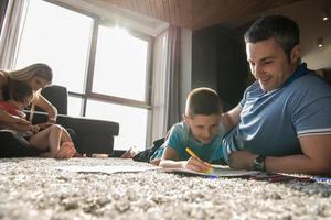 young couple spending time with kids photo