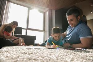 young couple spending time with kids photo